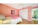 Well-lit bedroom with double doors and wood flooring at 3712 Hampshire Ln # 5623, Sarasota, FL 34232