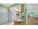 Modern kitchen featuring granite countertops and light wood cabinets at 3712 Hampshire Ln # 5623, Sarasota, FL 34232