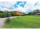 Golf clubhouse with putting green and landscaping at 3712 Hampshire Ln # 5623, Sarasota, FL 34232