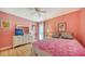 Bright bedroom featuring a mirrored dresser and a comfortable bed at 3712 Hampshire Ln # 5623, Sarasota, FL 34232