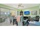 Home office with built-in shelving and two comfortable armchairs at 3712 Hampshire Ln # 5623, Sarasota, FL 34232