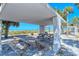 Picnic tables under modern concrete beachside shelter at 3712 Hampshire Ln # 5623, Sarasota, FL 34232