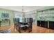 Bright dining area with a glass-top table and built-in hutch at 3712 Hampshire Ln # 5623, Sarasota, FL 34232