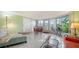 Spacious sunroom with seating area and outdoor access at 3712 Hampshire Ln # 5623, Sarasota, FL 34232