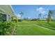 Landscaped walkway with lush grass, leading through a neighborhood at 3712 Hampshire Ln # 5623, Sarasota, FL 34232