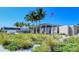 Siesta Beach pavilion with lush landscaping and American flag at 3712 Hampshire Ln # 5623, Sarasota, FL 34232