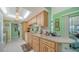 Well-equipped kitchen with light wood cabinets and granite countertops at 3712 Hampshire Ln # 5623, Sarasota, FL 34232