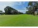 Lush green golf course with mature trees and landscaping at 3712 Hampshire Ln # 5623, Sarasota, FL 34232