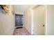 Interior entryway with a dark door and tiled floor at 3712 Hampshire Ln # 5623, Sarasota, FL 34232