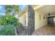 Ornate gate opens to a tiled entryway with a dark door at 3712 Hampshire Ln # 5623, Sarasota, FL 34232