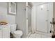 Small bathroom with toilet, shower and white vanity at 4011 Midland Rd, Sarasota, FL 34231