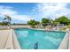 Community pool with lounge chairs and a life preserver at 4803 Park Acres Dr, Bradenton, FL 34207
