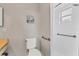 Simple bathroom with a toilet, shower, and grab bars at 4803 Park Acres Dr, Bradenton, FL 34207