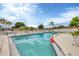 Community pool with lounge chairs and a life preserver at 4803 Park Acres Dr, Bradenton, FL 34207