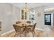 Bright dining area with a glass-top table and wicker chairs at 4803 Park Acres Dr, Bradenton, FL 34207