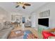 Spacious living room with comfy seating and a large TV at 4803 Park Acres Dr, Bradenton, FL 34207