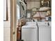 Stackable washer and dryer in a compact laundry room at 4803 Park Acres Dr, Bradenton, FL 34207