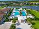 Large community pool with a stage and surrounding landscape at 4950 Kiva Cir, Bradenton, FL 34211