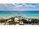 Aerial view of a beach pier and surrounding buildings at 505 N Tamiami Trail # 202, Venice, FL 34285