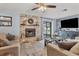 Living room with stone fireplace, and flat-screen TV at 5470 80Th Avenue E Cir, Palmetto, FL 34221