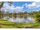 Serene lake view with lush greenery and homes at 5470 80Th Avenue E Cir, Palmetto, FL 34221