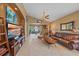 Spacious living room with leather sofas and large TV at 6023 Wingspan Way, Bradenton, FL 34203