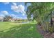 Backyard view of a lake and other homes at 6023 Wingspan Way, Bradenton, FL 34203