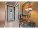 Bright entryway with a decorative table and mirror at 6023 Wingspan Way, Bradenton, FL 34203