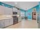 Modern kitchen with light cabinets, stainless steel appliances, and a breakfast bar at 6023 Wingspan Way, Bradenton, FL 34203