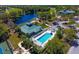 Community pool and clubhouse with tennis courts nearby at 6023 Wingspan Way, Bradenton, FL 34203