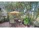 Lush patio with seating and a view of the lake at 6023 Wingspan Way, Bradenton, FL 34203