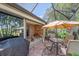 Screened patio with table, chairs, and grill at 6023 Wingspan Way, Bradenton, FL 34203