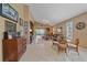 Open living room with tiled floors, leather furniture, and view to the back at 6023 Wingspan Way, Bradenton, FL 34203