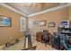 Home office with a desk, workout equipment, and window at 6023 Wingspan Way, Bradenton, FL 34203