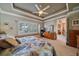 Spacious main bedroom with large window and dresser at 6023 Wingspan Way, Bradenton, FL 34203