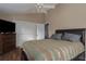 Main bedroom with dark wood dresser and ceiling fan at 6211 30Th E Ave, Palmetto, FL 34221