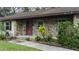 Stone facade home with covered porch and manicured landscaping at 6211 30Th E Ave, Palmetto, FL 34221