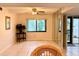 Bright living room with hardwood floors and access to a patio at 6447 Egret Ln # 413, Bradenton, FL 34210