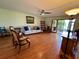 Spacious living room with hardwood floors and patio access at 6447 Egret Ln # 413, Bradenton, FL 34210