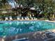 Refreshing community pool area with ample lounge chairs for relaxation at 6447 Egret Ln # 413, Bradenton, FL 34210