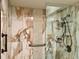 Walk-in shower with marble tile and glass enclosure at 6447 Egret Ln # 413, Bradenton, FL 34210