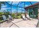 Spacious patio with lounge chairs and tranquil views at 85 Spaniards Rd, Placida, FL 33946