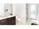 Bathroom with single vanity, granite countertop, and a walk-in shower at 85 Spaniards Rd, Placida, FL 33946