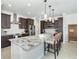 Spacious kitchen featuring granite countertops and dark wood cabinetry at 85 Spaniards Rd, Placida, FL 33946