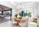 Elegant dining room with wooden table and access to the pool area at 85 Spaniards Rd, Placida, FL 33946
