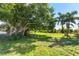 Spacious lot with mature trees and lush landscaping at 85 Spaniards Rd, Placida, FL 33946
