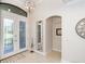 Bright entryway with double doors, mirror, and decorative accents at 85 Spaniards Rd, Placida, FL 33946