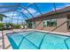 Inviting screened pool with adjacent patio seating at 85 Spaniards Rd, Placida, FL 33946