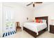 King-size bedroom with private door to backyard and built-in storage at 85 Spaniards Rd, Placida, FL 33946