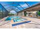 Large screened pool and spa with view into home at 85 Spaniards Rd, Placida, FL 33946